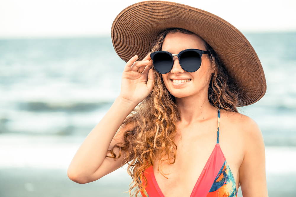 Capelli al sole: come proteggere la chioma durante l'estate